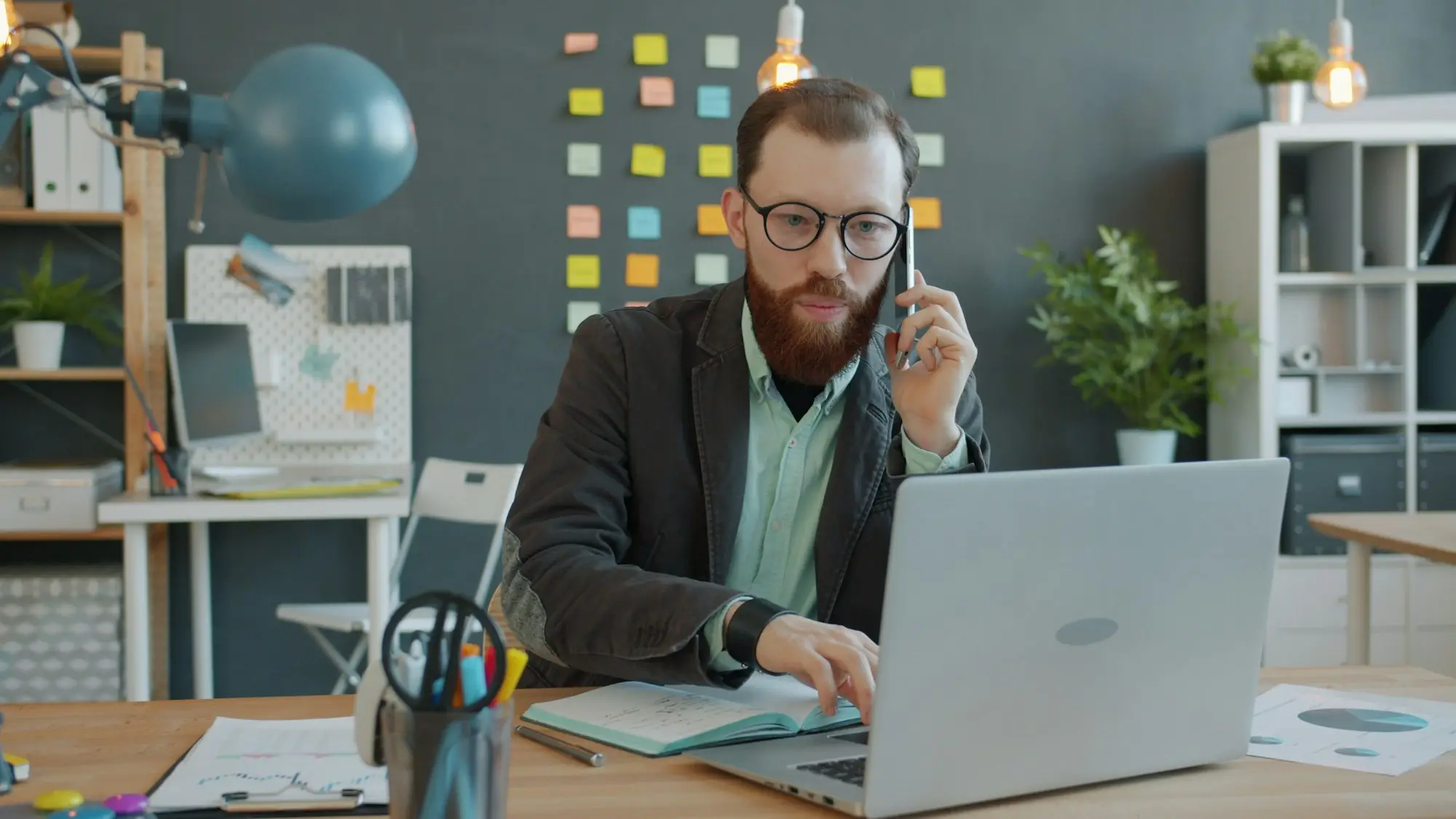 Business owner on a phone call at his desk