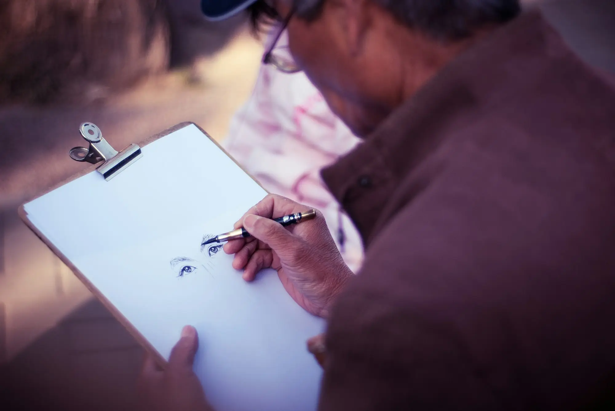 Assessor making notes on a clipboard during an inspection