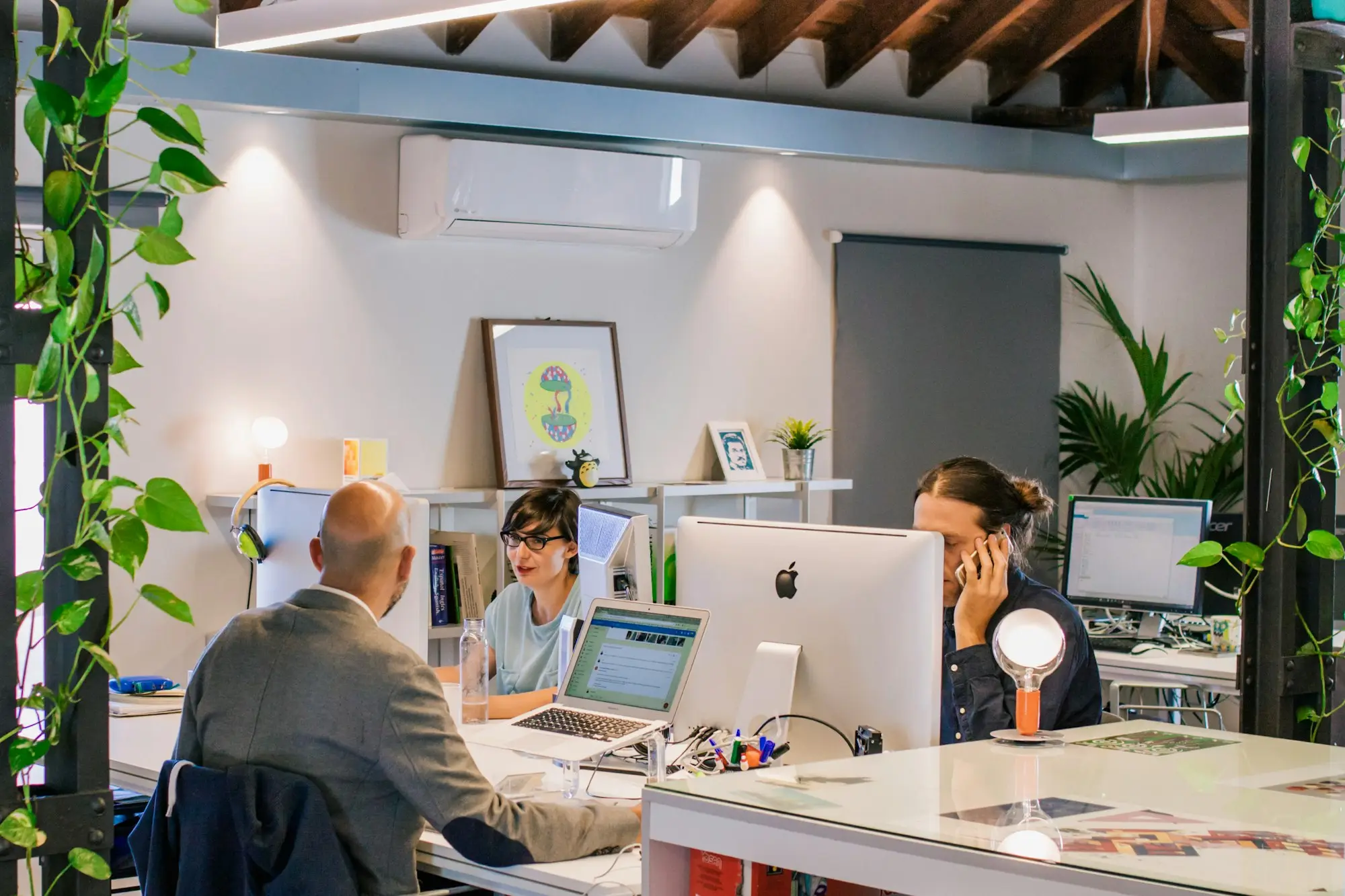Business owner reviewing unpaid invoices in a shared office